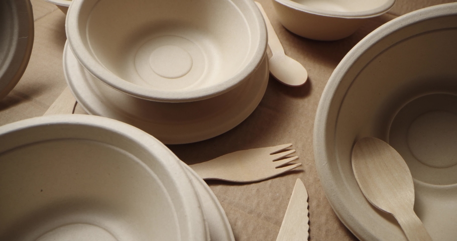 Eco friendly disposable tableware. recycled paper dishes and wooden cutlery | Shutterstock HD Video #1079234336