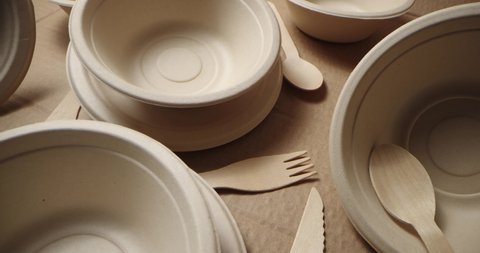 eco friendly disposable tableware. recycled paper dishes and wooden cutlery