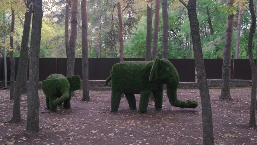 Green Elephants in park. Green spaces 4k