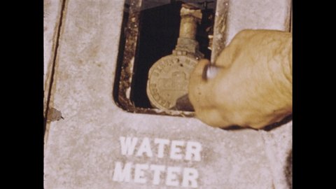 1950s: Dial water meter. Machines in a laboratory. Scientist with a flask and water sample. Scientist looks through a magnifying glass. Settling basins. Reservoir intake and pipe. Man pulls a chain.