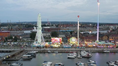 Szczecin , Poland - 08 11 2021: Amusement Park Rides With Colorful Lights At Dusk