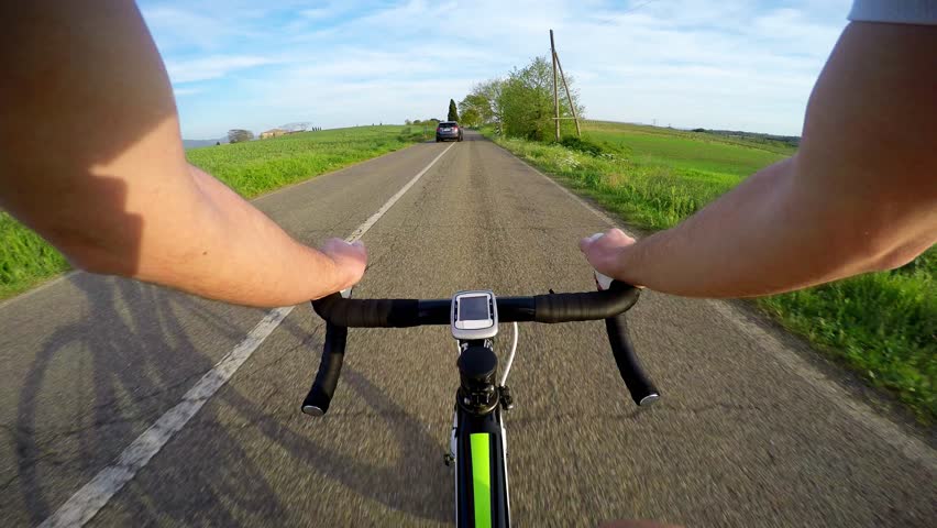 CYCLING IN SPRING AT SUNSET ON ROAD BIKE. Pov Original Point of View Royalty-Free Stock Footage #10792514