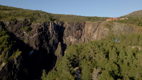 Cinematic aerial reveal of dramatic Voringsfossen falls, Norway