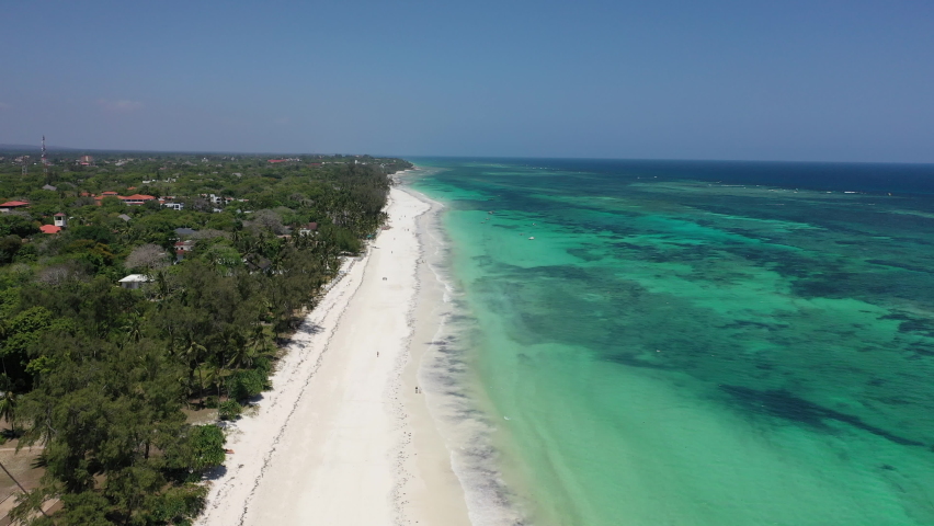 Diani beach Kenyan coast African Sea drone aerial 4k waves blue indan ocean tropical mombasa turquoise white sand East Africa palms paradise view | Shutterstock HD Video #1079253383