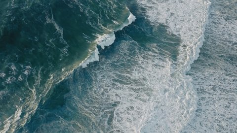 Aerial view of stormy bluish ocean with high tides. Wonderful natural beauty of the Atlantic Ocean. High quality 4k footage