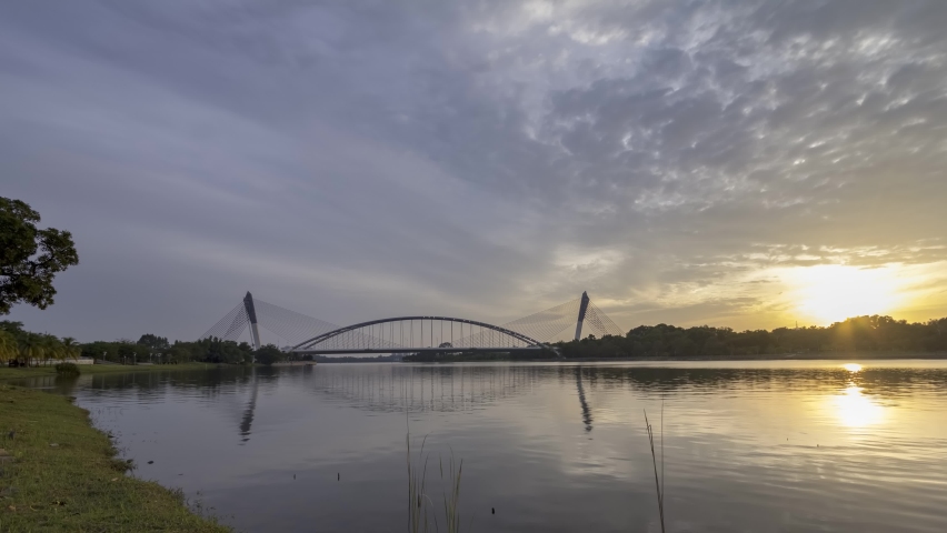 time lapse - View Of Putrajaya Bridge With Beautiful Lake during down