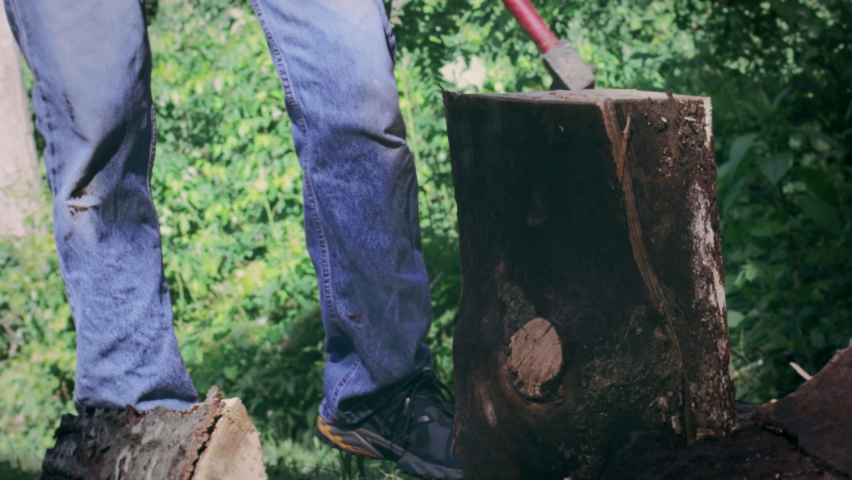 Man Chopping Wood With Axe Slow Motion