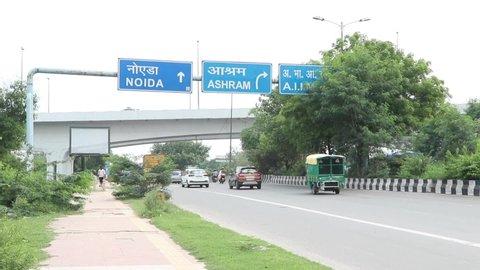Delhi, New Delhi, India - September 6 2021: A shot of Traffic moving on the Road in New Delhi, India