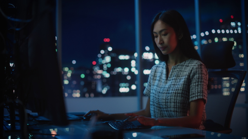 Portrait of a Financial Analyst Working on Computer with Multi-Monitor Workstation with Real-Time Stocks, Commodities and Exchange Market Charts. Businesswoman at Work in Investment Broker Agency. | Shutterstock HD Video #1079285462