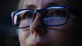 Close-up Portrait of Female Software Engineer Working on Computer, Programming Reflecting in Glasses. Developer Working on Innovative e-Commerce Application using Machine Learning, AI, Big Data - Powered by Shutterstock - Get 15% off with code: PIKWIZARD15