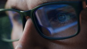 Super Close-up Portrait of Software Engineer Working on Computer, App Reflecting in Glasses. Digital Developer Working on Innovative e-Commerce Application with Machine Learning, AI, Big Data - Powered by Shutterstock - Get 15% off with code: PIKWIZARD15