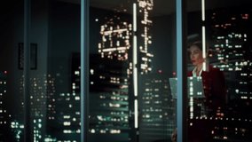Successful Businesswoman in Stylish Suit Working, on Laptop Looking in Wonder at Night City. Stylish Beautiful Female CEO Working Late on Computer to Achieve Best Results. Colorful Cinematic Portrait - Powered by Shutterstock - Get 15% off with code: PIKWIZARD15