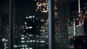 Successful Businesswoman in Stylish Suit Working, on Laptop Looking in Wonder at Night City. Stylish Beautiful Female CEO Working Late on Computer to Achieve Best Results. Colorful Cinematic Portrait - Powered by Shutterstock - Get 15% off with code: PIKWIZARD15