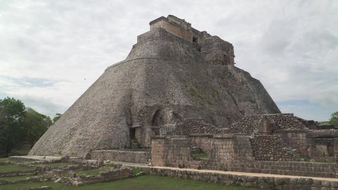 UXMAL, MEXICO - CIRCA 2021: Ruins of the Pyramid of the Magician also known as the Piramide del adivino, the central landmark of Uxmal, an ancient Mayan city in Yucatan peninsula