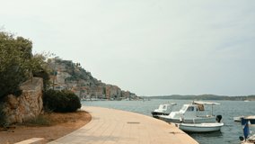 Young girl on the pier in Sibenik, Croatia. Slow motion video