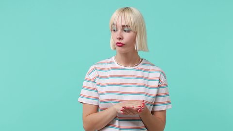 Displeased irritated gloomy sullen discontent young blonde short haircut woman 20s wears striped t-shirt applause cheering clapping hands isolated on pastel plain light blue background studio portrait