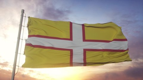 Dorset flag, England, waving in the wind, sky and sun background