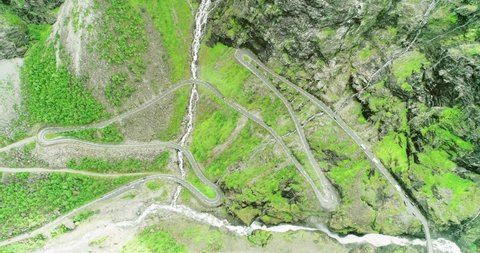 Trolls road hairpin curves in steep lush mountain hillside - aerial bird´s-eye