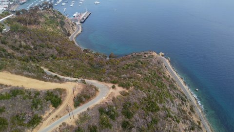 Drone Shot Overlooking Sloping Cliffs of Lovers Cove Turquoise Blue Ocean, Catalina Island