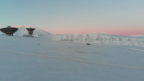 EISCAT radar (ESR) at Longyearbyen with pink sky background