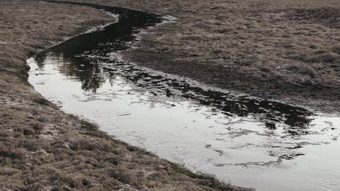 Drying up the lake and ephemeral river, oozy mud. Dry spell