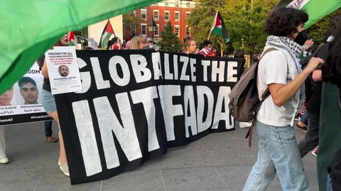 NYC, USA - SEPT 12, 2021: Globalize the Intifada sign at Palestinian rights protest - activists marching in New York City.