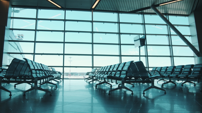 Empty airport terminal, no people. Pandemic, covid-19 lockdown concept. Airport departure lounge with no people in it | Shutterstock HD Video #1079343344