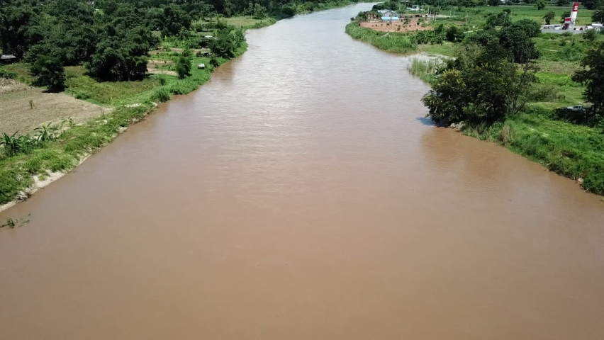 Drone flying over Kok river the river that runs through the city of Chiang Rai province of Thailand. The river originates in the Shan State of Burma and  flows through the town of Chiang Rai.