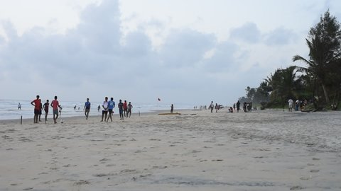 Carmona Beach, Goa India- September 18 2021: Locals and Tourists in Goa playing and relaxing in the evening at Carmona beach in Goa India