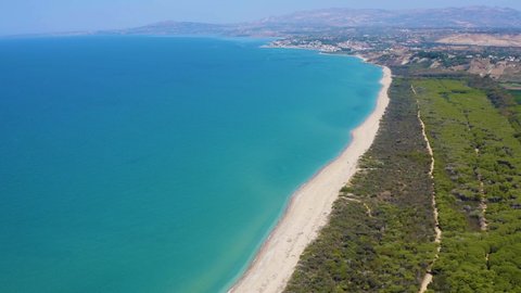 Aerial shot with drone of the Platani river mouth nature reserve. The river flows into the sea near Capo Bianco, a splendid cliff made up of limestone marl that dominates the reserve.