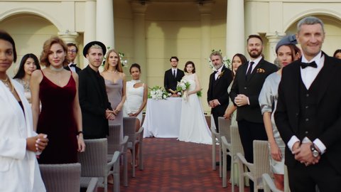 TRACKING WIDE to CU Camera traveling through the guests to bride portrait. Shot with 2x anamorphic lens