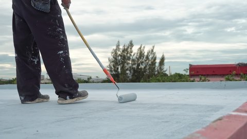 Hand painted gray flooring with paint rollers for waterproof, reinforcing net,Repairing waterproofing deck flooring.