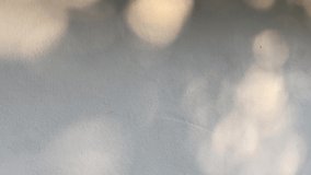 bokeh light on a wall. round nature sunlight reflect on cement wall. daytime light. shiny sun on surface. texture and background.  - Powered by Shutterstock - Get 15% off with code: PIKWIZARD15