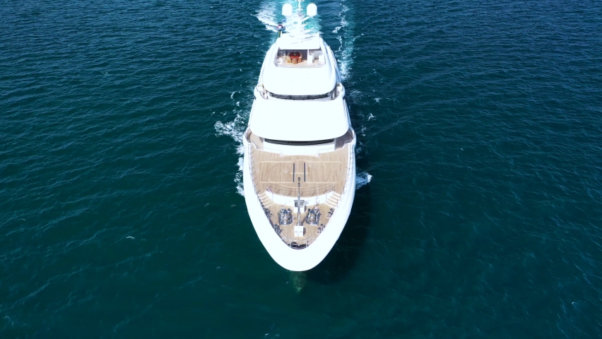 Aerial drone video of super yacht cruising deep blue Aegean sea near famous island of Mykonos, Cyclades, Greece Royalty-Free Stock Footage #1079380283