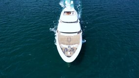 Aerial drone video of super yacht cruising deep blue Aegean sea near famous island of Mykonos, Cyclades, Greece