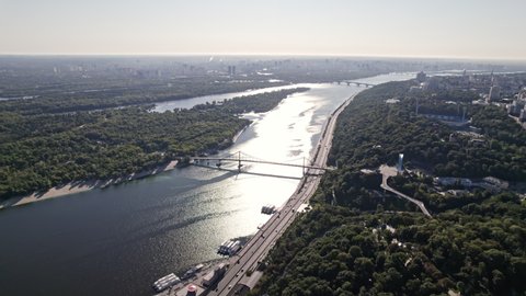 Kyiv, Ukraine - September, 2021: aerial drone view to Dnieper river in Kiev. Flight over capital - one of greenest metropolis in Europe. Ecology, nature concept.