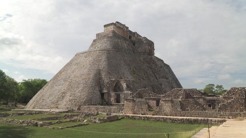 UXMAL, MEXICO - MAY 2021: The Pyramid of the Magician, a step pyramid and most important landmark of Uxmal, an ancient Mayan city in Yucatan
