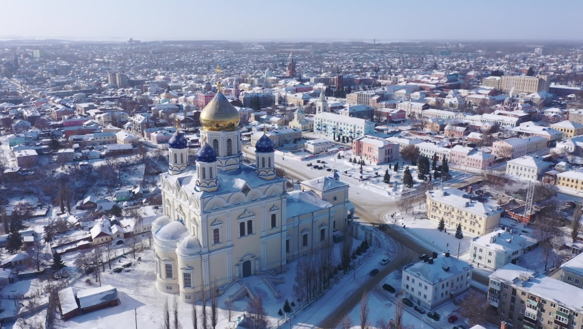 Top view of winter residential areas and Ascension Cathedral located in historical center of the city of Yelets, Russia.  Royalty-Free Stock Footage #1079393273