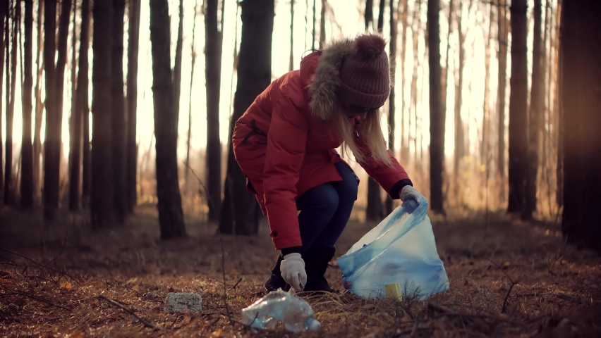 Picking Tidying Trash Recycling.Cleaner Woman Collecting Trash In Forest. Trash Volunteer Eco Activist. Clean Collects Garbage Plastic Empty Bottles. Ecology Volunteer Awareness Pollution. Save Planet Royalty-Free Stock Footage #1079394626