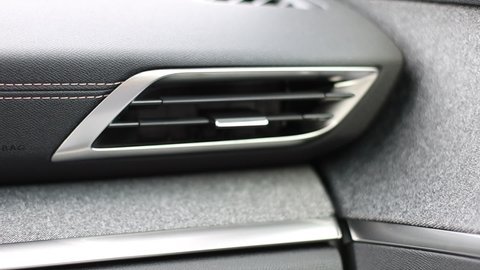 Air deflector, air conditioner in the car. Dashboard stitching and airbag lettering