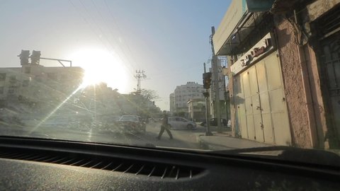 Street traffic as seen from a moving car in Gaza City, West Bank, the largest city of the State of Palestine, circa May 2021