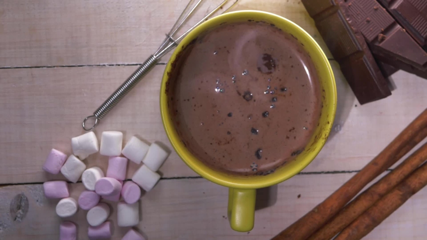 Hot chocolate drink steaming hot overhead slider dolly shot close up flat lay shot  | Shutterstock HD Video #1079410988