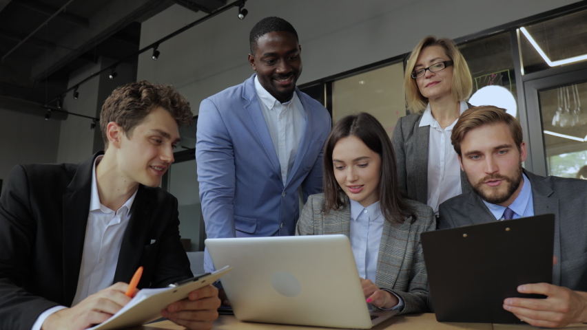 Business team discussing working during meeting and smiling. Group of happy business people having talk during meeting. Royalty-Free Stock Footage #1079415110