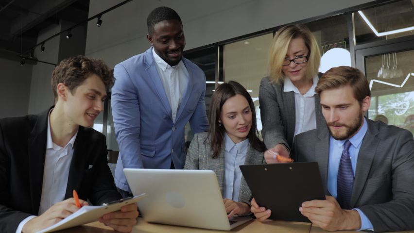 Business team discussing working during meeting and smiling. Group of happy business people having talk during meeting. Royalty-Free Stock Footage #1079415287