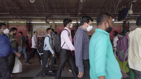 Mumbai, India - 09 15 2021 People Walking on the Foot Over bridge of Dadar railway station With Mask During Pandemic Covid 19, Mumbai, India.
