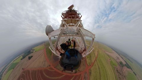 Viewpoint of a Base jumper jumping from an antenna. Special 360 degree image. Mini planet miniature.