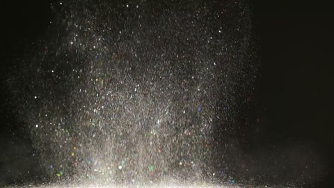 The fall of silvery particles. slow motion
