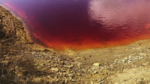 Toxic Red Waters Of Lagoon In Wheal Maid (Cornish Mars), Former Mine In Cornwall, England. - static