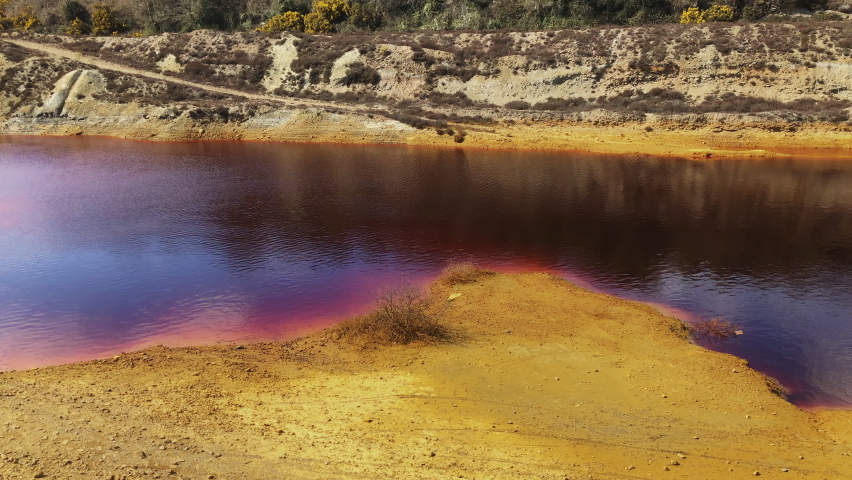 Cornish Mars - Coloured And Hazardous Waters Of Wheal Maid Tailings From Mining In Cornwall, England. - wide panning | Shutterstock HD Video #1079423759