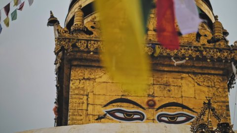 Painted on golden side of Swayambhunath stupa Buddha`s eyes looking, dove fly